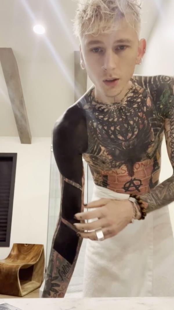 MGK shares video of getting viral blackout tattoo: 'Most painful s--t I ever experienced'