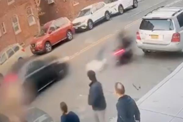 The motorbike is a<em></em>bout to slam into a parked gray SUV.