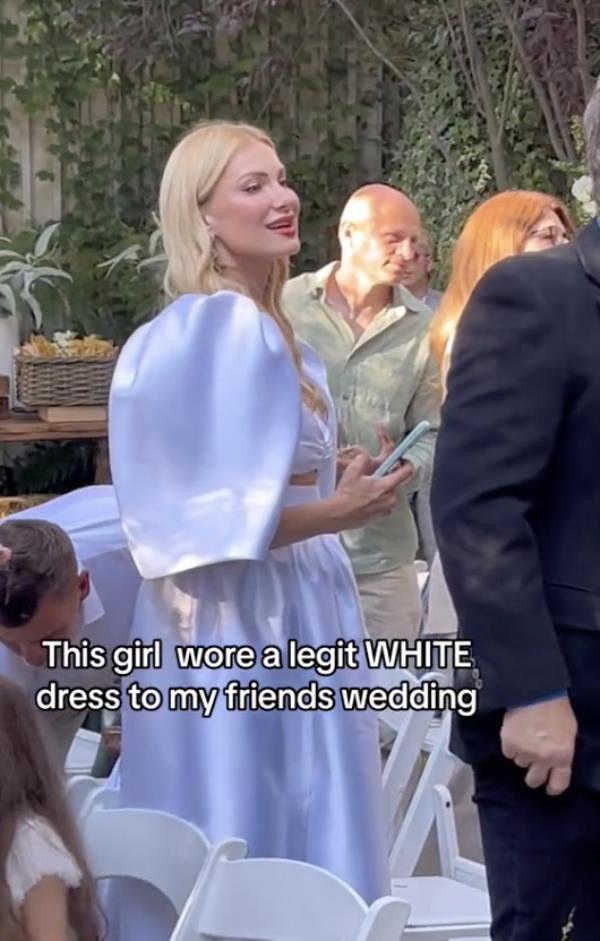 A screenshot of wedding guest Lana Kaufman, a married mom of four from Texas, wearing a white dress to a friend's nuptials.