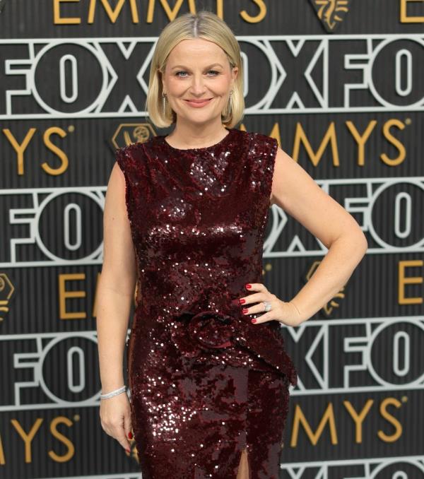 Amy Poehler poses on the Emmys 2024 red carpet. 