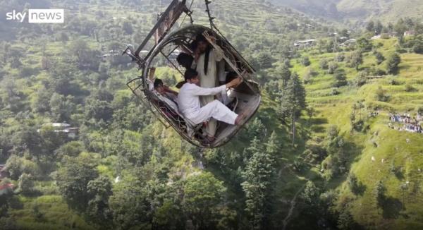 Trapped cable car passengers cling for their lives