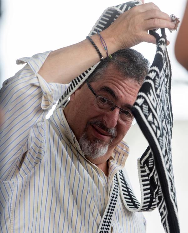 Presidential candidate for Movimiento Semilla, Bernardo Are<em></em>valo receives a gift from Mayan community leaders in Santa Cruz del Quiche, Guatemala on Aug.11, 2023, during a political rally.