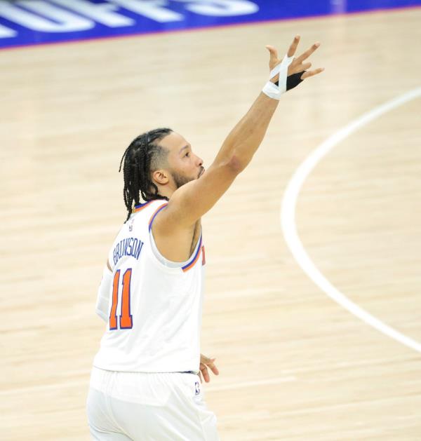Jalen Brunson #11 of the New York Knicks reacts after he hits a three point shot over Nicolas Batum #40 of the Philadelphia 76ers during the fourth quarter.