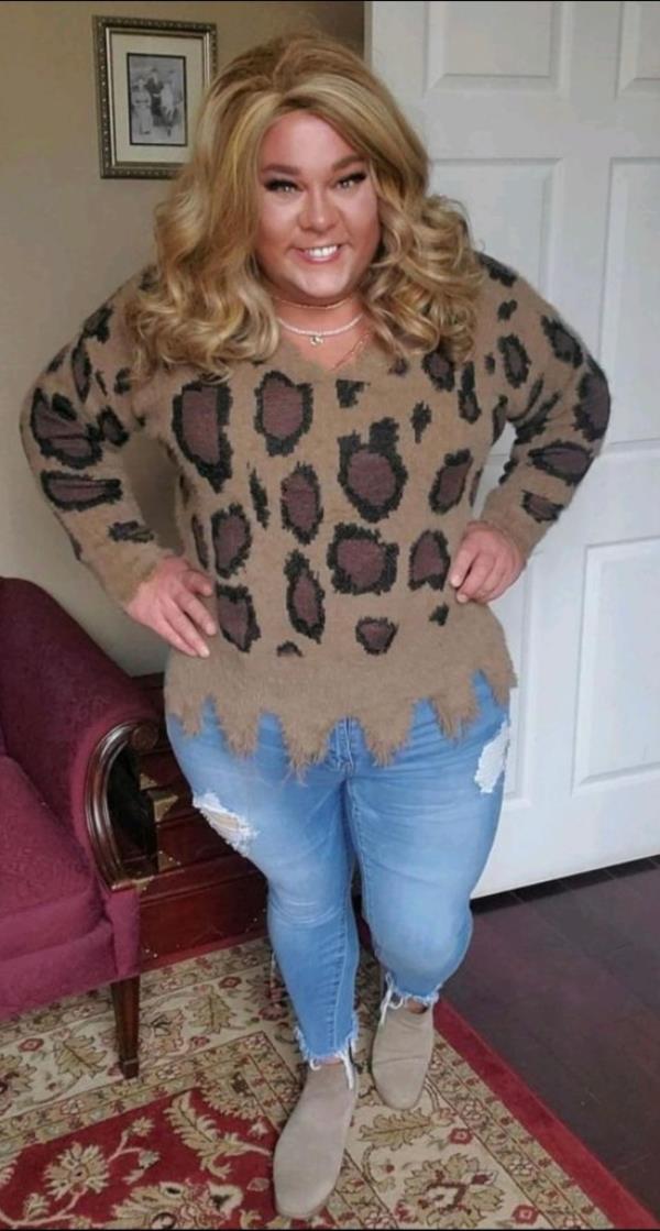 Alabama preacher Bubba Copeland dressed as his o<em></em>nline alter ego, Brittini, wearing makeup, a blond wig, a woman's sweater and jeans in a private house.