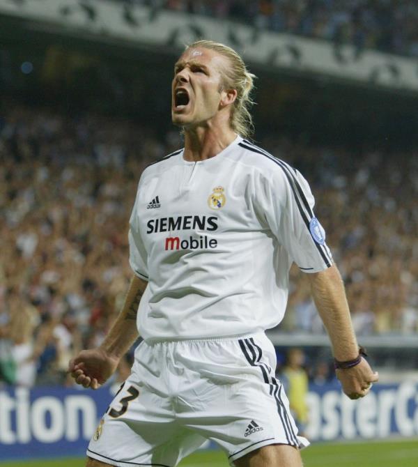 David Beckham celebrates after the first goal during the UEFA Champions League Group F match between Real Madrid and Olympic Marseille at the Santiago Bernabeu Stadium in 2003 in Madrid, Spain.
