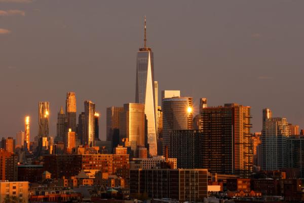 Sun setting over the skyline of lower Manhattan.