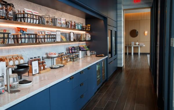 The Set's amenity space offers a kitchen full of drinks and snacks.