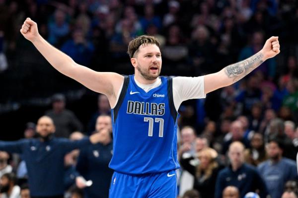 Luka Do<em></em>ncic of Dallas Mavericks raises his arms in respo<em></em>nse to a call, during NBA game against Orlando Magic at American Airlines Center.
