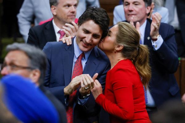 Canadian Prime Minister Justin Trudeau receives a kiss from his wife Sophie Gregoire, during U.S. President Joe Biden's visit at the House of Commons of Canada, in Ottawa, Ontario, Canada, March 24, 2023.