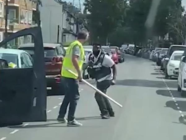 The men fighting in the street in East London. 