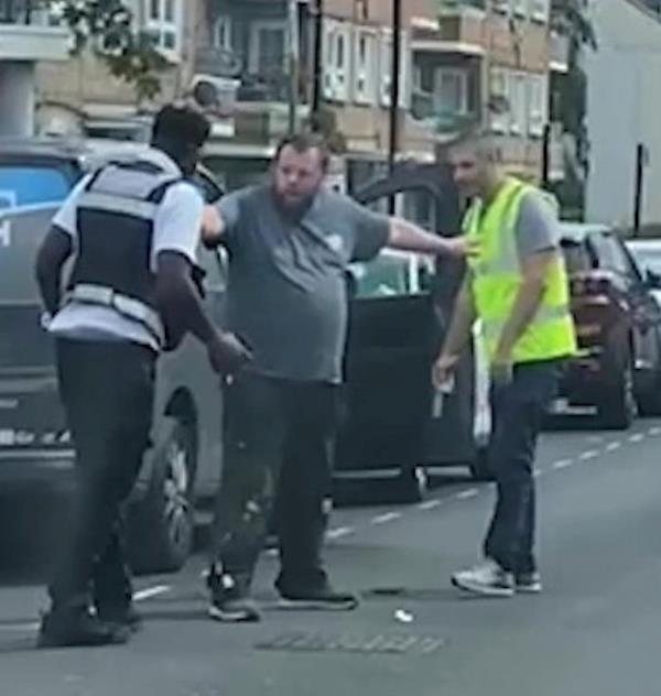 A man separating the two fighters. 