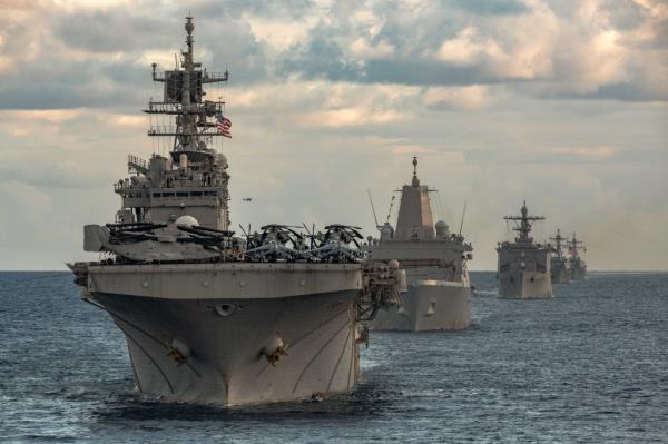 Ships from the Gerald R Ford. Carrier Strike Group sail in formation in the Mediterranean Sea on Dec. 31, 2023.