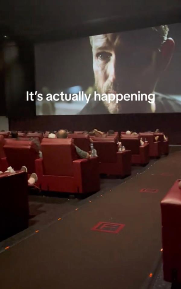 Audience members watch