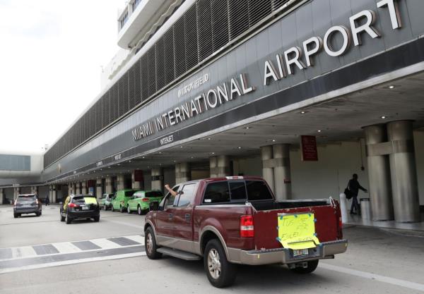 The three officers were arrested at the airport in July on charges they were involved in an organized scheme to defraud.