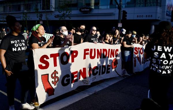 Anti-Israel protesters occupy Oympic Boulevard outside of LA Live as Biden holds his fundraiser inside the Peacock Theater on June 15, 2024.