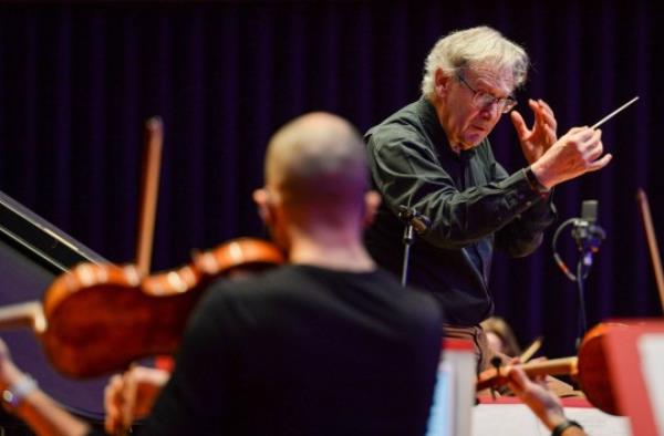 POOLE, ENGLAND - FEBRUARY 23: Co<em></em>nductor Sir John Eliot Gardiner rehearses with Bournemouth Symphony Orchestra on stage on February 23, 2021 in Poole, England. Bournemouth Symphony Orchestra returns in full to the stage at Lighthouse, Poole with Sir John Eliot Gardiner and pianist Stephen Hough; their co<em></em>ncert broadcasts live viabsolive.comon Wednesday. (Photo by Finnbarr Webster/Getty Images)