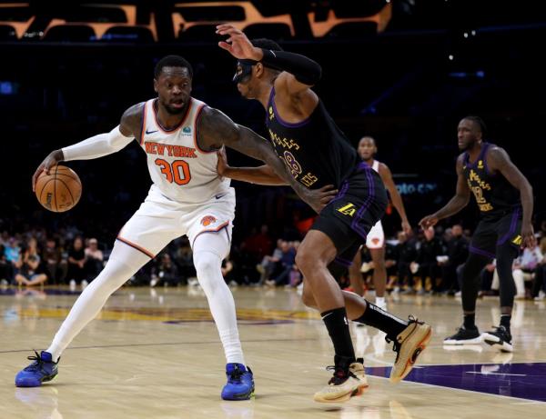 New York Knicks post up Rui Hachimura #28 of the Los Angeles Lakers during the first half.