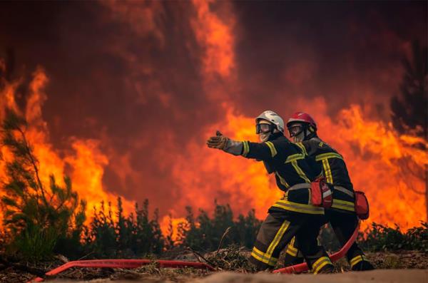 Firefighters battling a wildfire in La Test-de-Buch, southwestern France, July 18, 2022