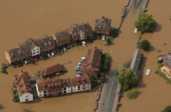 Flood waters surround the town of Tewkesbury, England following torrential rain in July 2007. 