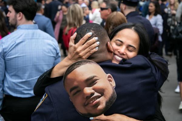 NYPD Academy graduate celebrates.