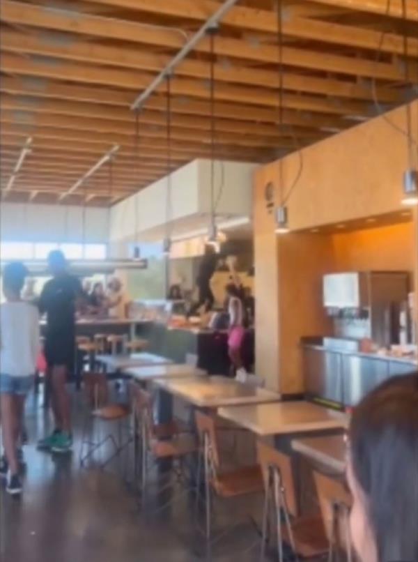 Video of the incident taken by bystanders shows three women attacking the store's employees. 