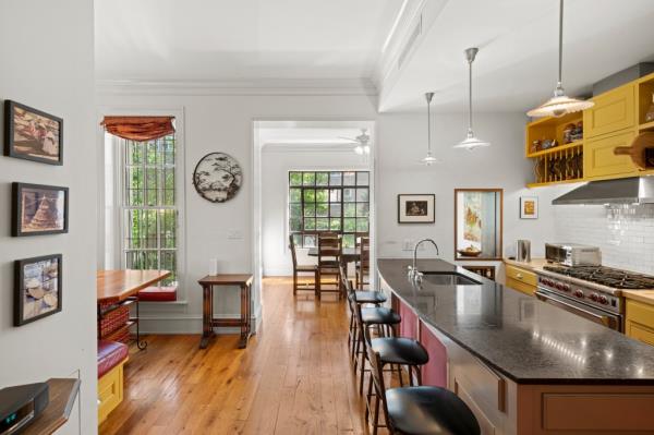 Casement windows overlook an enchanted garden.