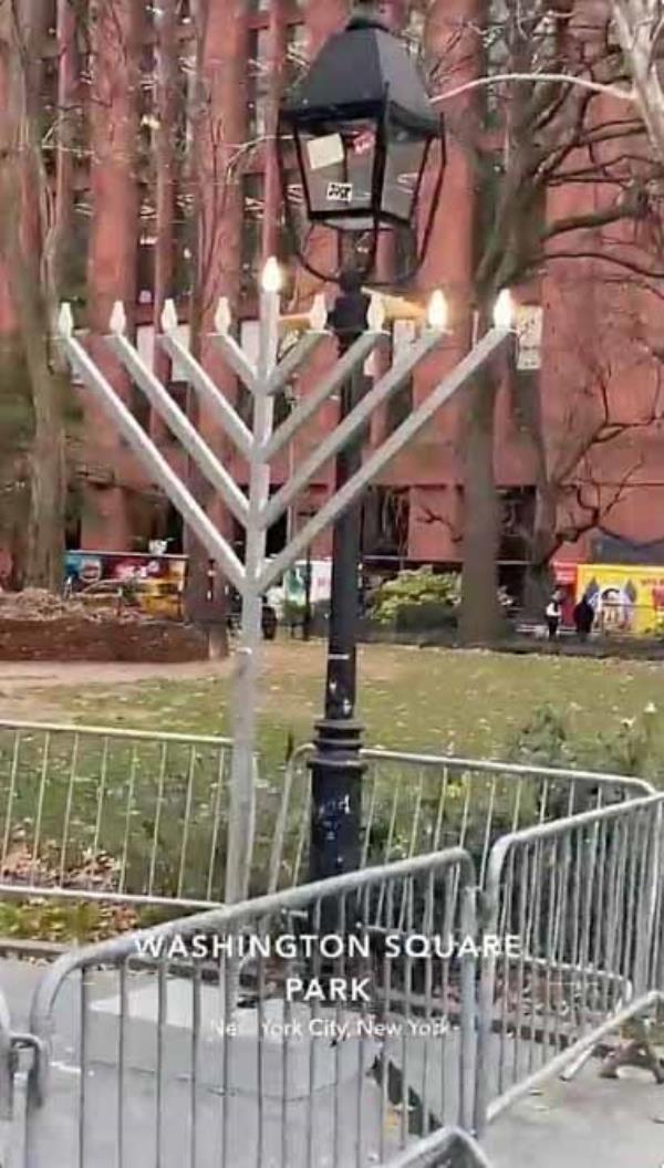 large menorah in Washington Square fences off by me<em></em>tal medians 