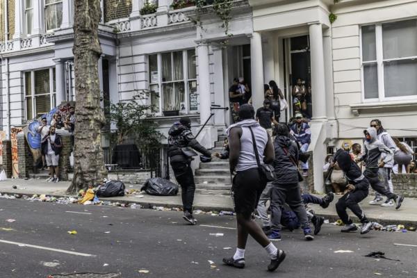 Violent riots and vicious attacks plagued festivities, leaving eight people stabbed as a 29-year-old man remains in critical condition.