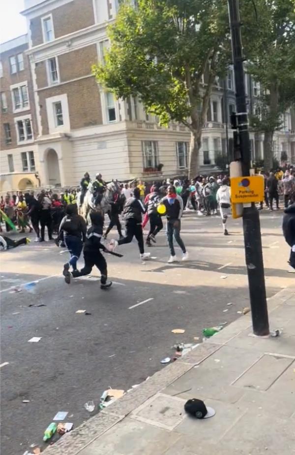 Videos circulating social media show groups of young people running down a street dressed in black and wearing ski masks Mo<em></em>nday night.