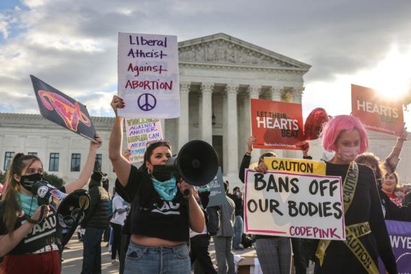 Pro-choice and anti-abortion both demo<em></em>nstrate outside the United States Supreme Court as the court hears arguments over a challenge to a Texas law that bans abortion after six weeks in Washington, U.S., November 1, 2021.