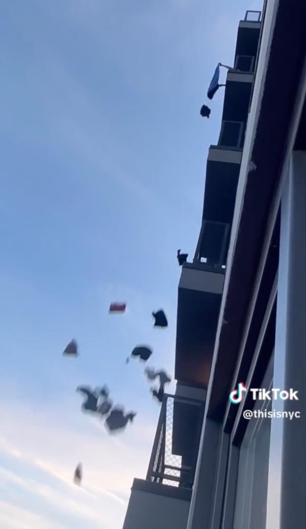 Screen shots showing a woman throwing clothing and household items from a balcony in Bedford Stuyvesant section of Brooklyn