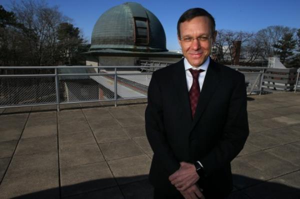 Professor Avi Loeb stood on the roof of an observatory.