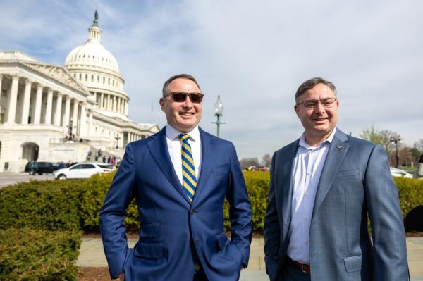 Virginia co<em></em>ngressional candidate Eugene Vindman with his twin brother Alex outside of hte Capitol building on March 13, 2024.