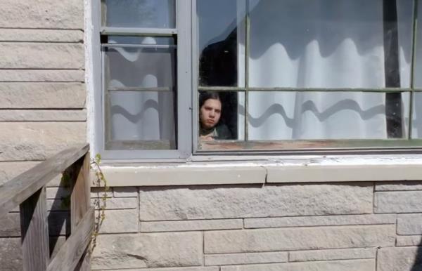 Natalia Grace looking out a window. 