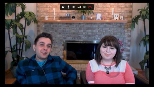 Two people smiling on a zoom call. 