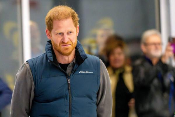 Prince Harry, Duke of Sussex, and Michael Buble curling in Vancouver.