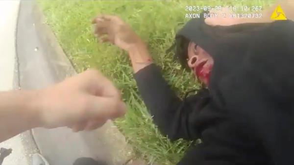 When Sullivan gets close enough, he shoots him twice with the stun gun and Woods falls face-first o<em></em>nto the pavement.