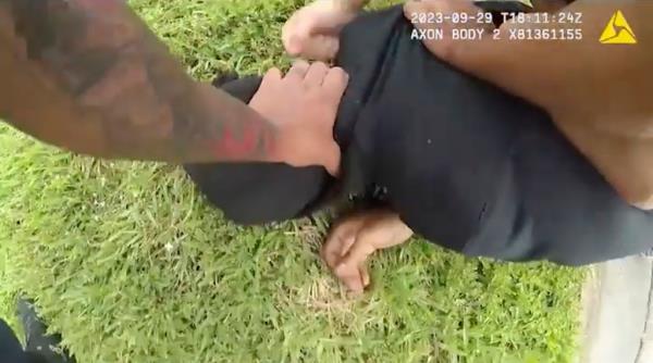 Woods, who is 5-foot-8-inches tall and 160 pounds, squirms and sometimes puts one hand or the other behind his back, but then moves the other beneath him.