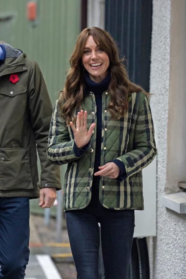 Duchess of Rothesay in green plaid jacket waves at Highland charity for young people, during visit to Scotland with Duke of Rothesay.
