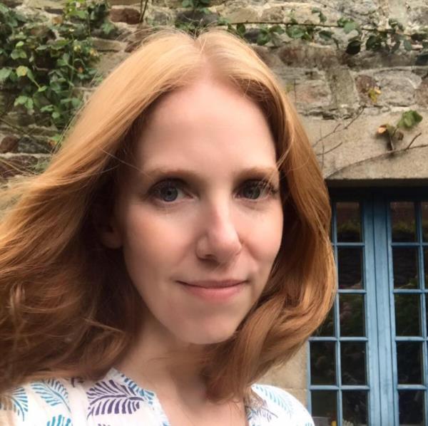 A woman smiling for a selfie, Casey Greenfield