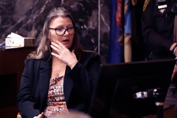 Jennifer Crumbley looks at a mo<em></em>nitor as she testifies during her trial in the Oakland County courtroom on Tuesday.