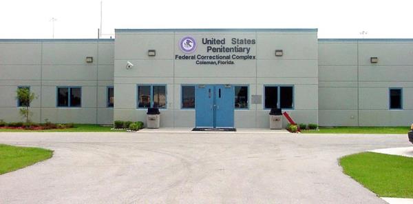 Maximum-security federal prison, USP Coleman II, near Orlando, Florida, with building featuring blue doors.