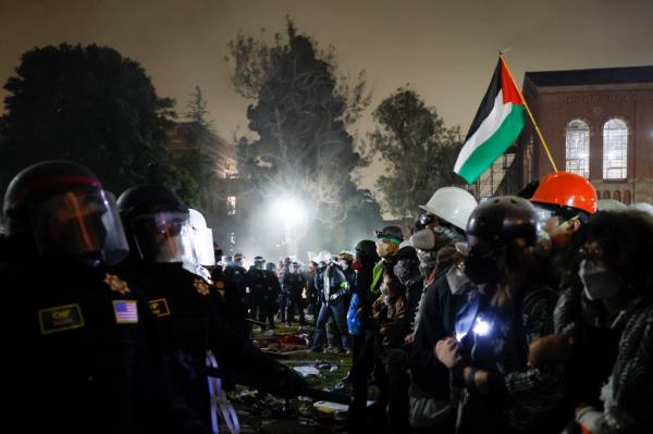 Anti-Israel protesters face off against police at UCLA early Thursday.