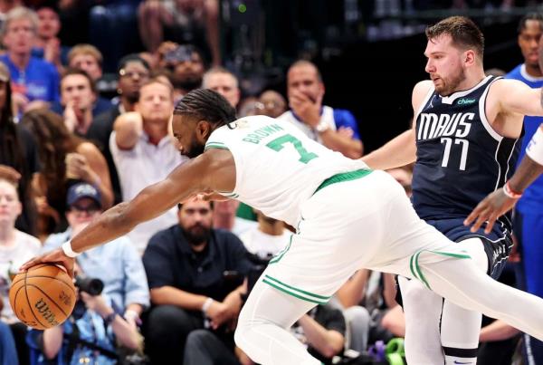 Luka Do<em></em>ncic (right) is called for a blocking foul on Jaylen Brown, his sixth and final foul of the game, during the fourth quarter of the Celtics' 106-99 Game 3 win over the Mavericks. 