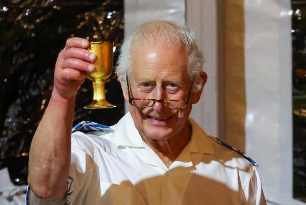 King Charles of Britain raising a glass at a reception in the Robert Louis Stevenson Museum in Samoa