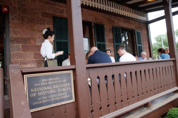 Customers dine outside on the front porch of Spring House. 