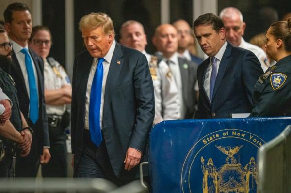 Former U.S. President Do<em></em>nald Trump walking down a stage at his Manhattan trial wher<em></em>e he was co<em></em>nvicted on 34 counts, May 30th 2024, photo by Steven Hirsch