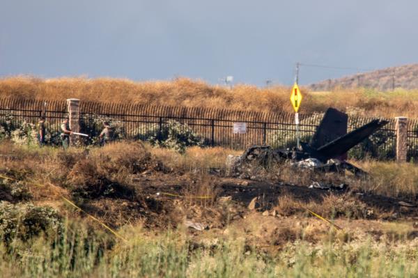 investigators are pictured at the scene of a small plane crash in Southern California.