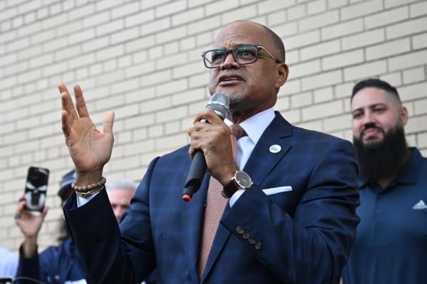 Chancellor of New York City Public Schools David C. Banks using a microphone to welcome students and families on the first day of school at PS 257 John F. Hylan in 2024