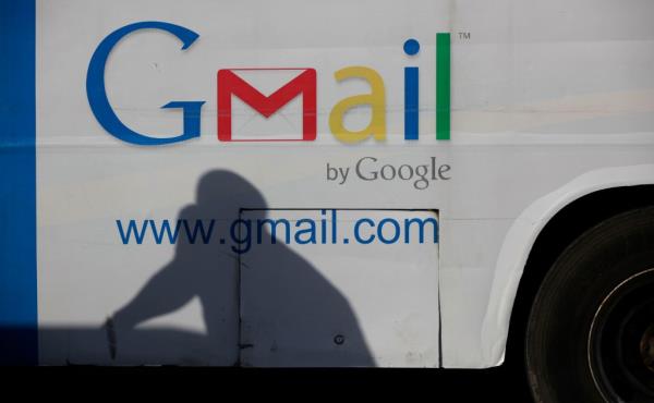 An ad for Google's Gmail appears on the side of a bus